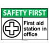 A green safety first ANSI sign saying "First Aid Station In office" for medical emergencies
